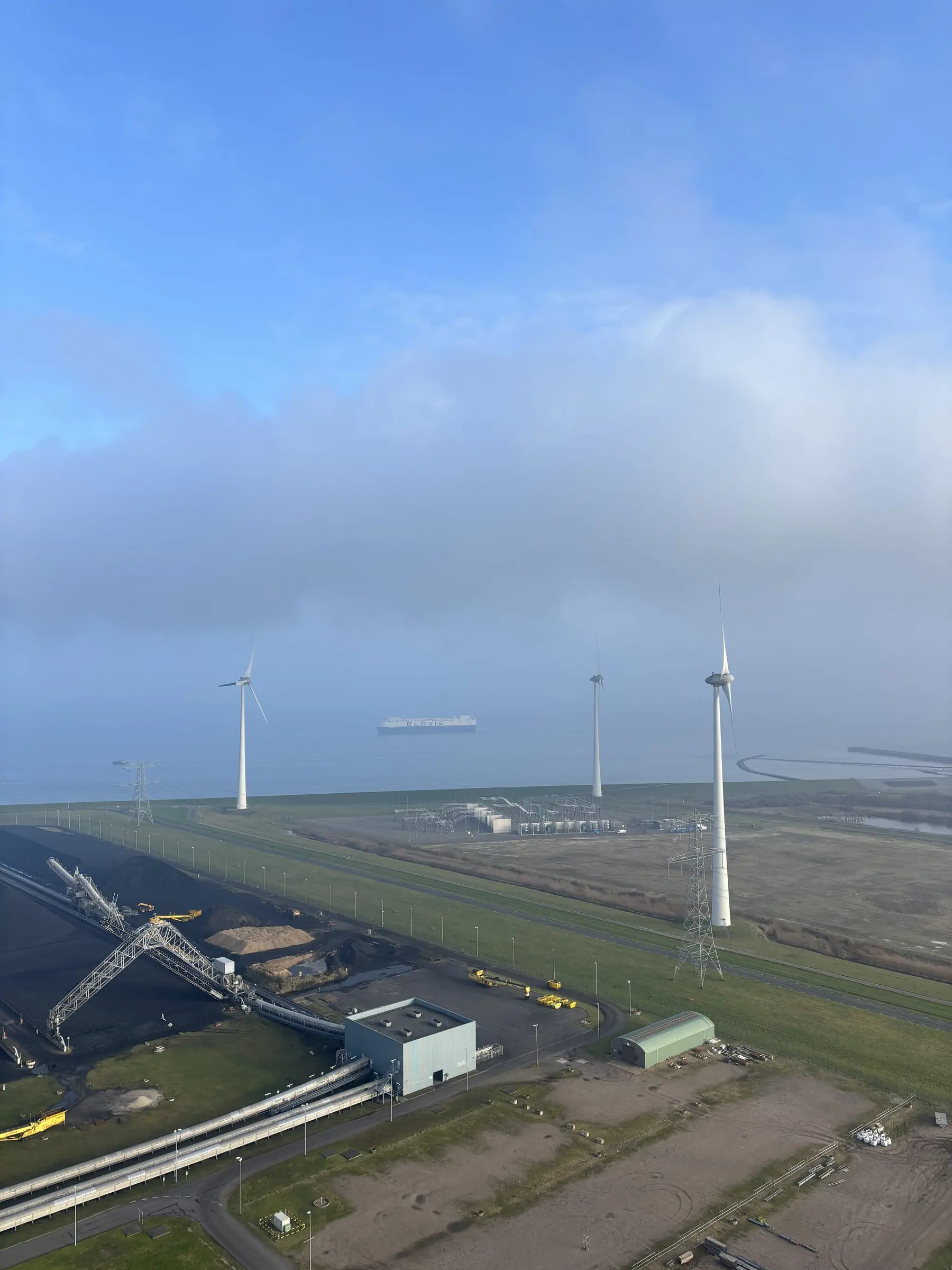 Wind turbines and fields seen from above