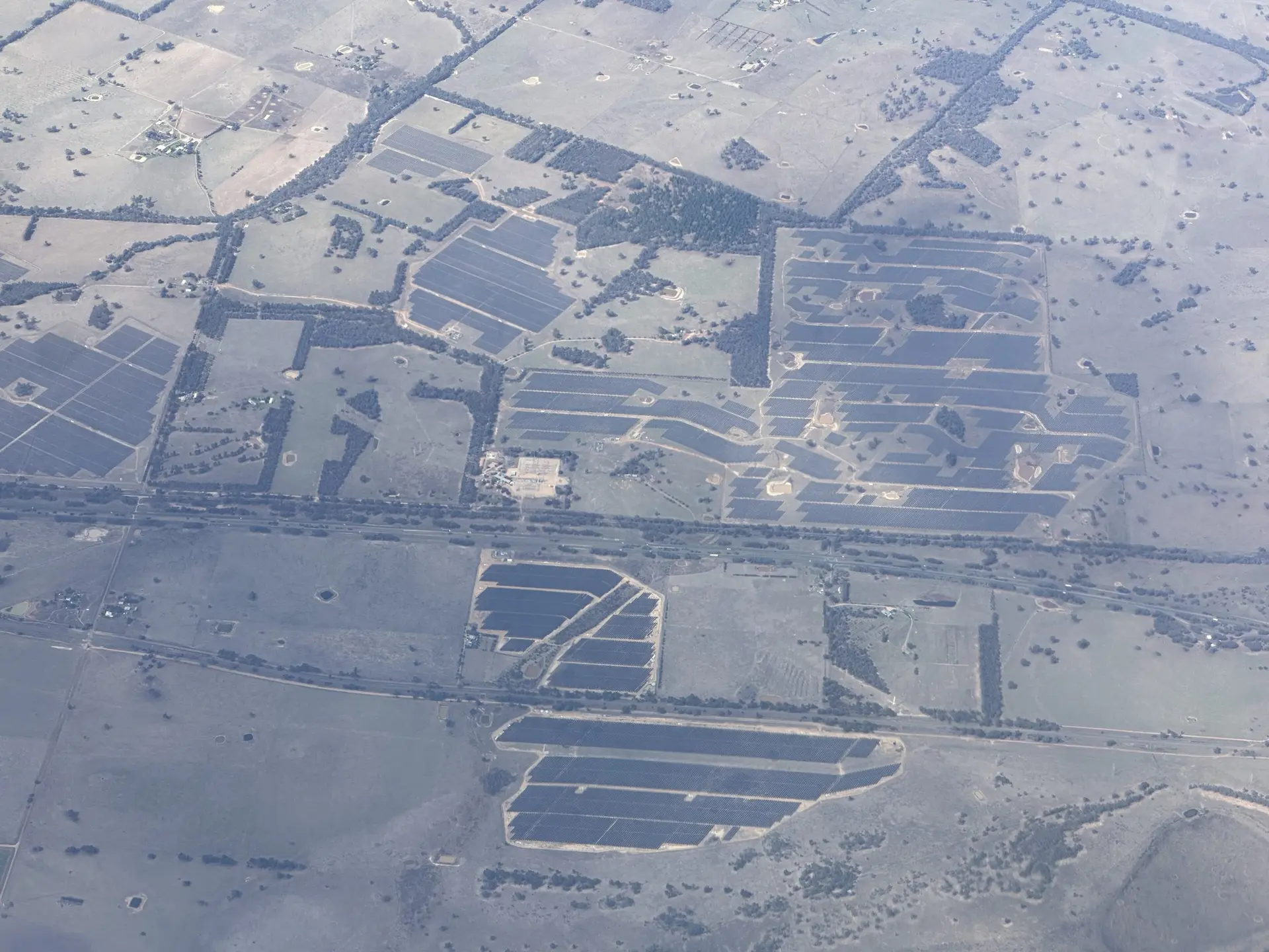 Aerial view of solar farms across open country