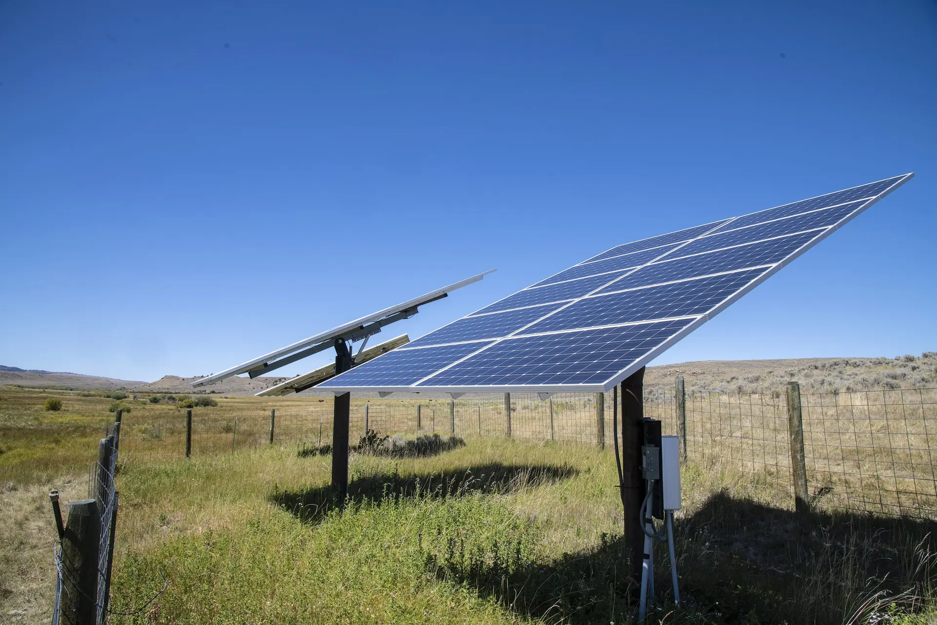 Solar panels powering a water pump