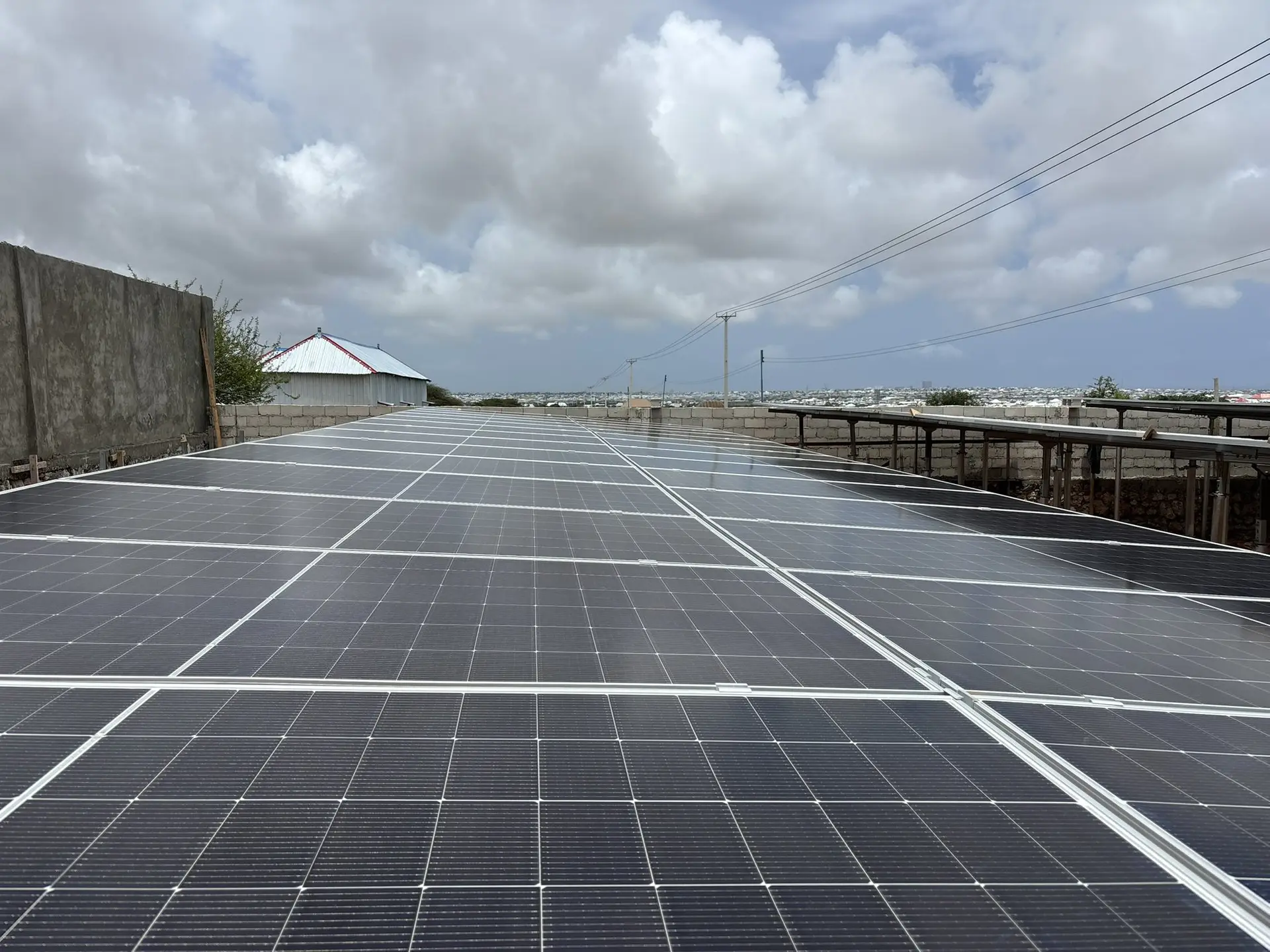 Wide rows of solar panels at a ground-mounted installation