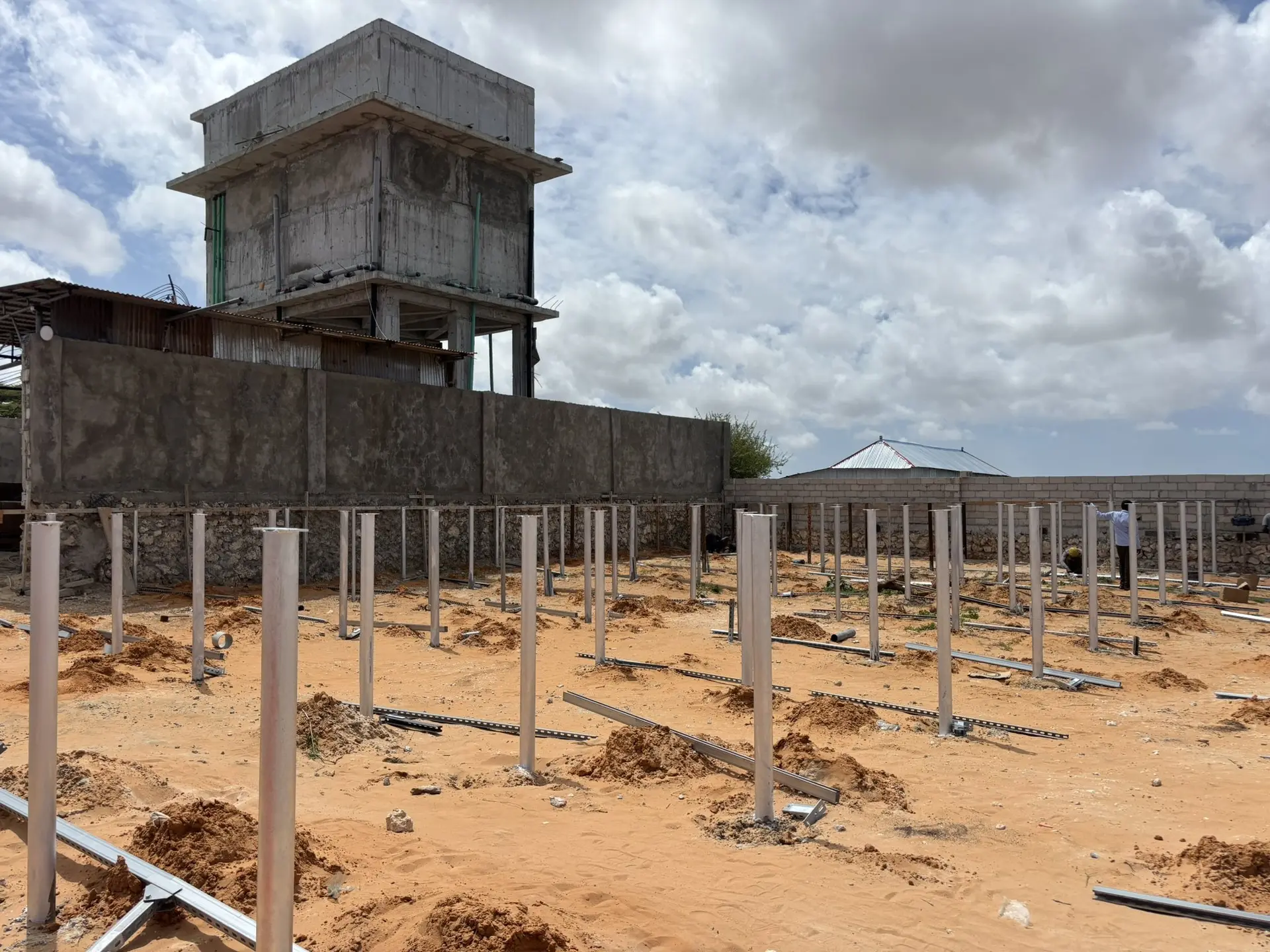 Mounting piles installed in front of a water tower