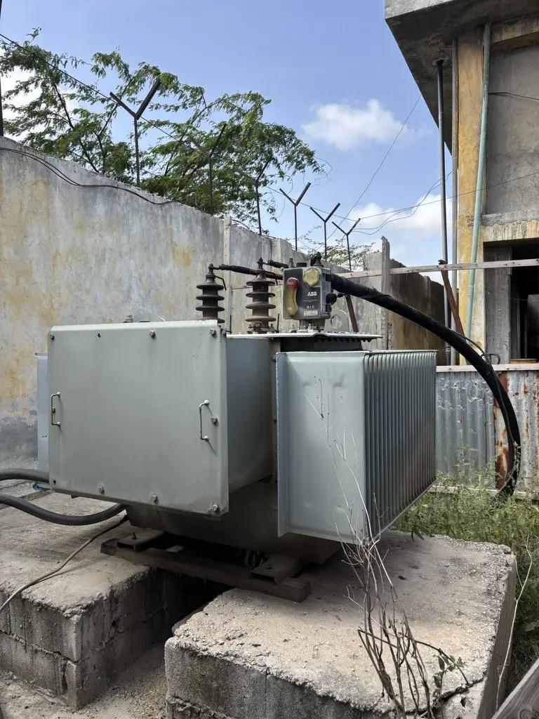 Distribution transformer on a concrete plinth